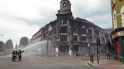 Firemen_in_action_at_Tottenham_riots_2011_aftermath.ogv The morning after the riots.