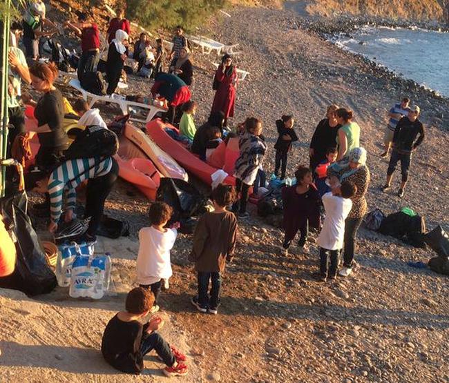 New arrivals to Europe in typical Lesbos beach scene