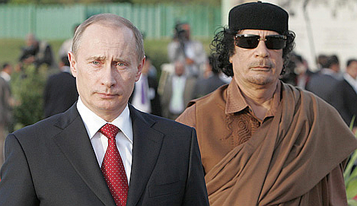 Putin and Gaddafi Two dictators, one Libyan and one Russian, walk together